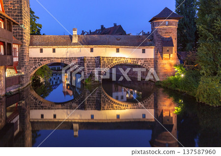 Historic stone bridge with reflections at night in Nuremberg Germany Historic stone bridge with reflections at night in Nuremberg Germany 137587960