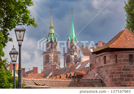 View of Saint Sebald Church towers above old rooftops in Nuremberg Germany View of Saint Sebald Church towers above old rooftops in Nuremberg Germany 137587965