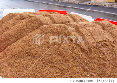 pile of sand for building or laying pipes. pile of sand for building or laying pipes. 137588144