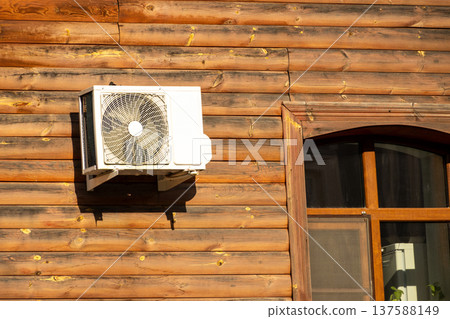 air conditioning on facade of building, air cooling in hot weather. air conditioning on facade of building, air cooling in hot weather. 137588149