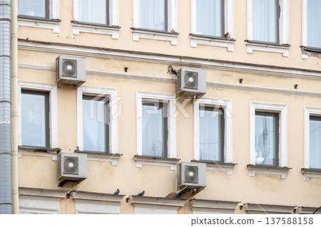air conditioning on facade of building, air cooling in hot weather.  137588158