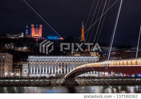 Lyon, france. December 28, 2023. Lyon night skyline with illuminated fourviere basilica, palais de justice and saone river reflecting city lights Lyon, france. December 28, 2023. Lyon night skyline with illuminated fourviere basilica, palais de justice and saone river reflecting city lights 137588362
