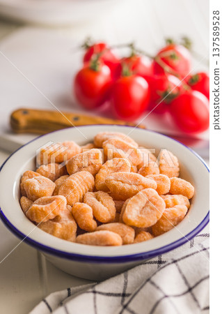 Rustic tomato Gnocchi in Bowl Ready to Cook Comforting Italian Pasta Dish Rustic tomato Gnocchi in Bowl Ready to Cook Comforting Italian Pasta Dish 137589528