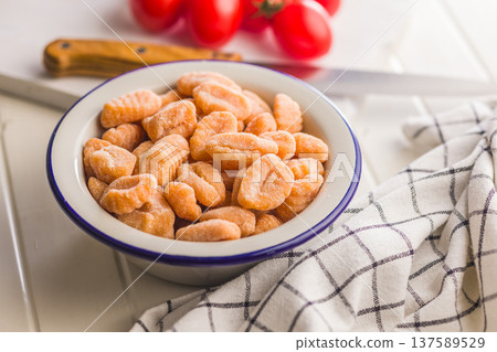 Rustic tomato Gnocchi in Bowl Ready to Cook Comforting Italian Pasta Dish Rustic tomato Gnocchi in Bowl Ready to Cook Comforting Italian Pasta Dish 137589529