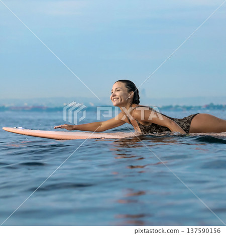 Energetic Woman With Bright Smile Engaged In Coastal Surfing Adventure Energetic Woman With Bright Smile Engaged In Coastal Surfing Adventure 137590156