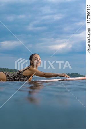 Gentle Sea Environment As Woman Practices Mindful Paddleboarding Techniques Gentle Sea Environment As Woman Practices Mindful Paddleboarding Techniques 137590162