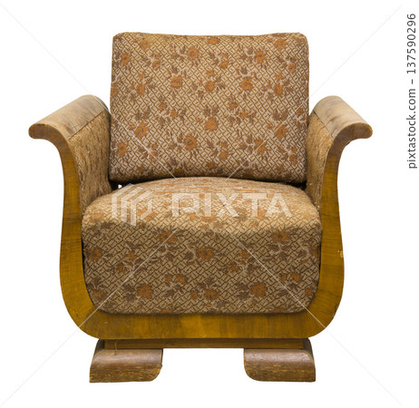 Vintage upholstered chair with unique wooden legs in an isolated setting 137590296