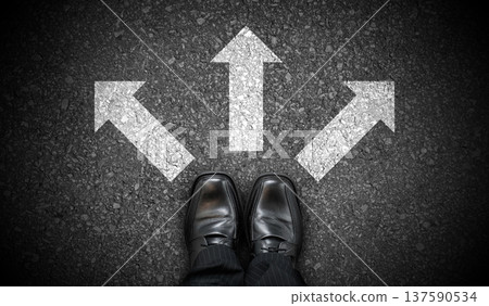 Black business shoes and three chalky arrows on asphalt - decision concept Black business shoes and three chalky arrows on asphalt - decision concept 137590534