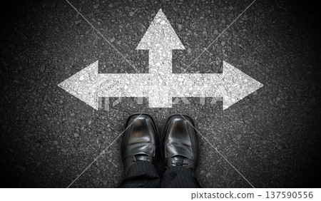 Black business shoes and chalky arrows in three directions on asphalt - choice concept 137590556