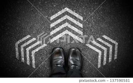 Black business shoes and three chalky arrows on asphalt - decision concept Black business shoes and three chalky arrows on asphalt - decision concept 137590581