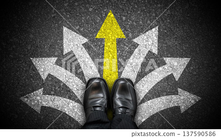 Black business shoes and many chalky arrows on asphalt - decision concept 137590586