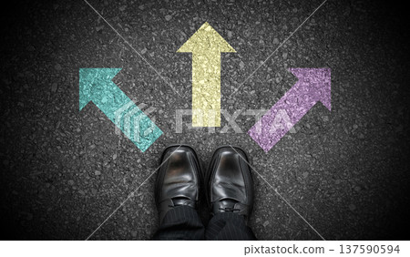 Black business shoes and three colorful chalky arrows on asphalt - direction concept Black business shoes and three colorful chalky arrows on asphalt - direction concept 137590594