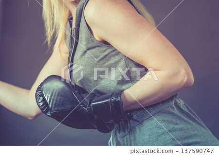 Boxer girl exercise with boxing gloves. Boxer girl exercise with boxing gloves. 137590747