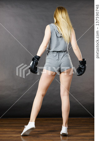 Boxer girl exercise with boxing gloves. Boxer girl exercise with boxing gloves. 137590748