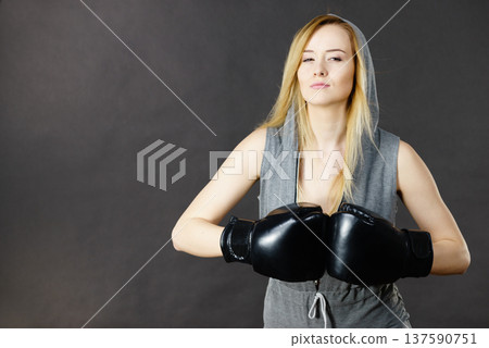 Boxer girl exercise with boxing gloves. Boxer girl exercise with boxing gloves. 137590751
