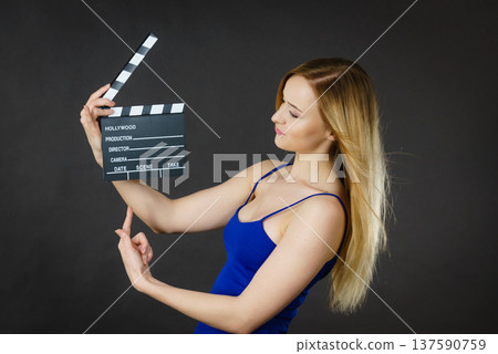 Woman holding professional film slate 137590759
