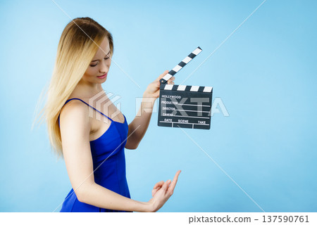 Woman holding professional film slate Woman holding professional film slate 137590761
