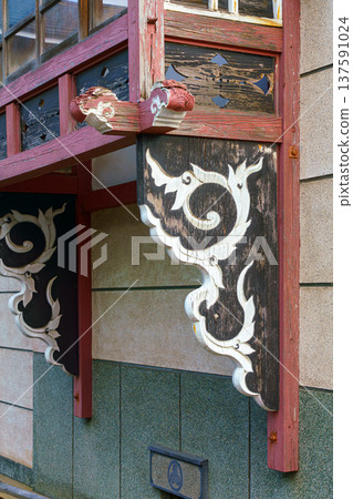 Sakata, Yamagata, japan - Oct 5 2024, Vertical view of a carved wooden window sill in Japanese style with a floral pattern, Sakata, Japan Sakata, Yamagata, japan - Oct 5 2024, Vertical view of a carved wooden window sill in Japanese style with a floral pattern, Sakata, Japan 137591024