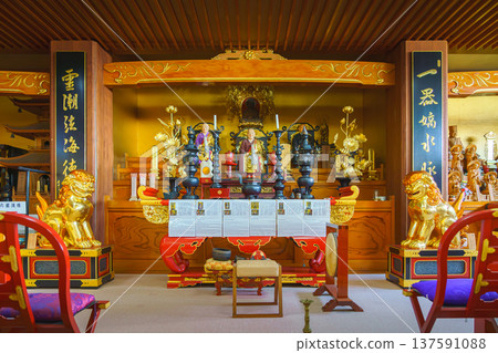 Sakata, Yamagata, japan - Oct 5 2024, A panoramic view of main sanctuary of Jichi-in Temple, decorated with various gilded chandeliers, statues,  etc. , located in temple's columbarium, Sakata, Japan 137591088