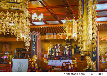 Sakata, Yamagata, japan - Oct 5 2024, A panoramic view of main sanctuary of Jichi-in Temple, decorated with various gilded chandeliers, statues,  etc. , located in temple's columbarium, Sakata, Japan 137591090