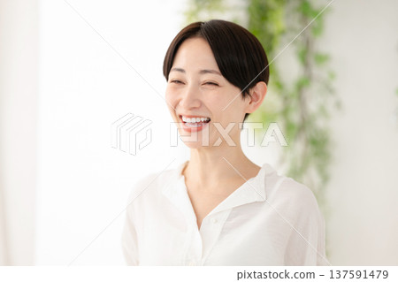 A smiling middle woman A smiling middle woman 137591479