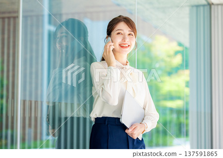 Woman talking on smartphone Business 137591865