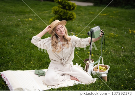Capturing joyful moments while relaxing in nature on a sunny afternoon Capturing joyful moments while relaxing in nature on a sunny afternoon 137592173