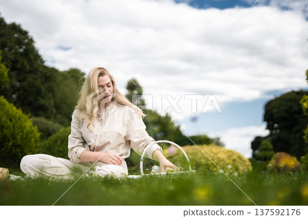 Enjoying a peaceful afternoon making soap bubbles in a sunny garden Enjoying a peaceful afternoon making soap bubbles in a sunny garden 137592176