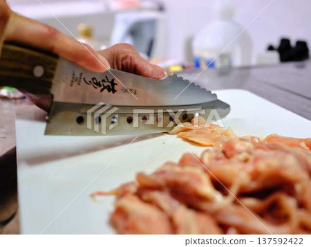 A female chef cutting domestically produced Japanese Black beef thigh meat A female chef cutting domestically produced Japanese Black beef thigh meat 137592422