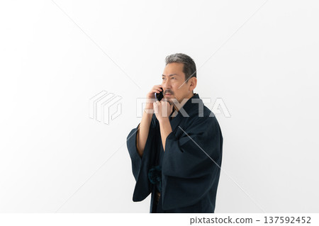 A man wearing a kimono A man wearing a kimono 137592452