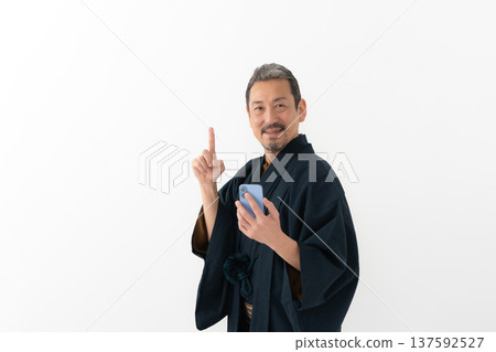Man wearing kimono, smartphone, smartphone Man wearing kimono, smartphone, smartphone 137592527