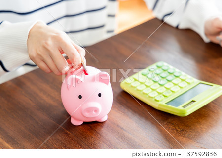 A woman saving money 137592836