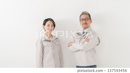 Men and women in work clothes 137593456