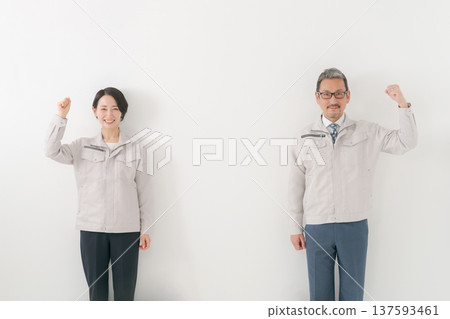 Men and women in work clothes 137593461