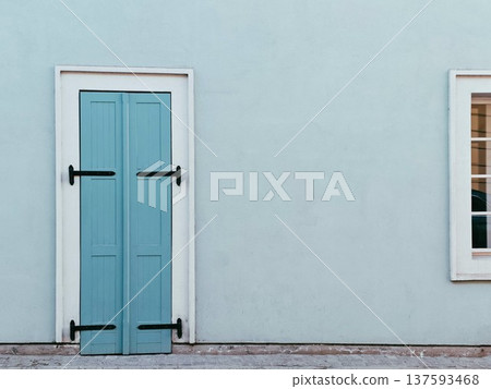 Blue wooden door on clean wall Blue wooden door on clean wall 137593468