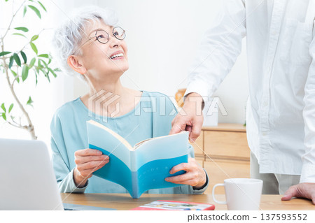 Senior woman being taught how to use a computer Senior woman being taught how to use a computer 137593552