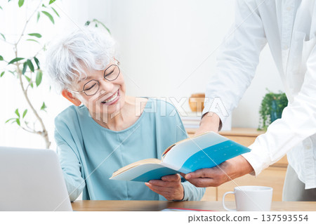 Senior woman being taught how to use a computer 137593554