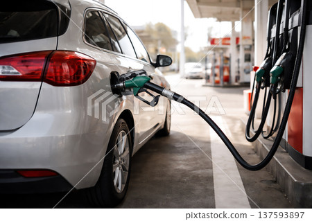 Filling up at a gas station: Image of rising energy prices 137593897