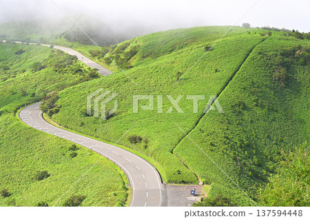 Izuyama Ridge Trail on the Izu Peninsula: The summer ridge trail and Nishiizu Skyline as the fog clears from Mt. Daruma Izuyama Ridge Trail on the Izu Peninsula: The summer ridge trail and Nishiizu Skyline as the fog clears from Mt. Daruma 137594448