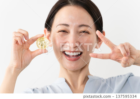 Woman holding Bitcoin Technology image Woman holding Bitcoin Technology image 137595334