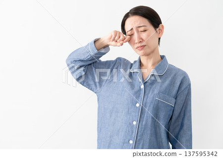 Woman wearing pajamas Lifestyle image Woman wearing pajamas Lifestyle image 137595342