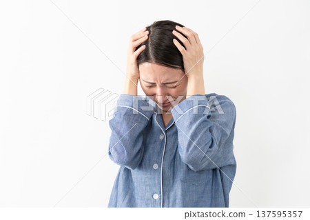 Woman wearing pajamas Lifestyle image Woman wearing pajamas Lifestyle image 137595357