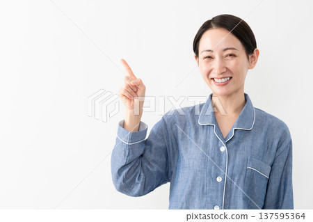 Woman wearing pajamas Lifestyle image Woman wearing pajamas Lifestyle image 137595364
