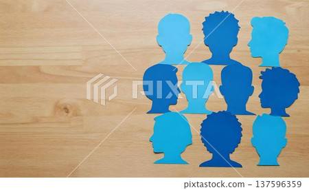 A group of blue paper cutouts representing people, highlighting Tar Syndrome Awareness Month with a ribbon background 137596359