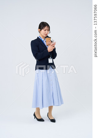 A businesswoman taking a break with a relaxed expression 137597066