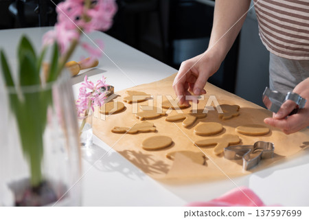 Creating Gingerbread Cookies for Easter Celebration With Family and Friends in the Kitchen 137597699