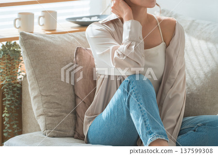 Stylish housewife Asian woman relaxing on the sofa in the living room 137599308