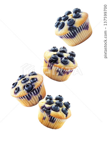 Multiple fresh blueberry muffins in scattered arrangement, isolated on white background. Concept of tasty homemade baking 137599700