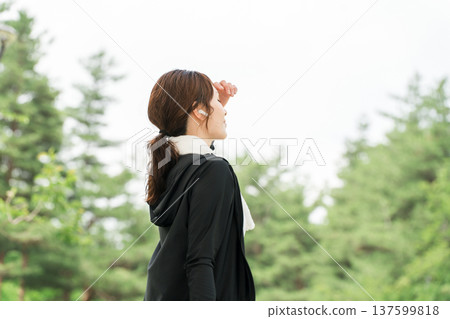 Woman running, walking, jogging, exercising (diet, sports) with earphones in the park Woman running, walking, jogging, exercising (diet, sports) with earphones in the park 137599818