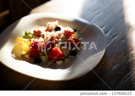 salad of fresh vegetables and homemade brynza cheese 137600225